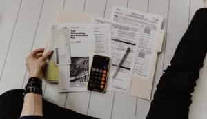 Calculator and money on a desk representing a budget